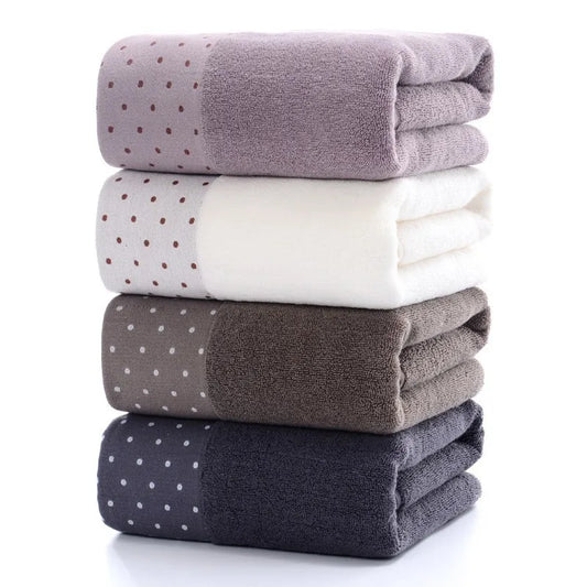 Amiriva oversized 70x140cm bath towel in cream, brown, and grey with soft combed cotton, quick-dry performance, and embroidered geometric design
